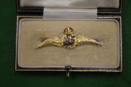 A 9ct gold and enamel RAF brooch.