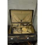 Dressing case containing part fitted set of silver topped dressing table jars etc.