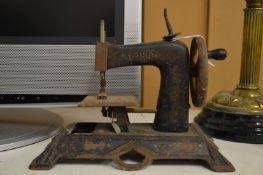 Miniature sewing machine.