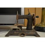 Miniature sewing machine.