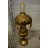 Decorative brass oil lamps.