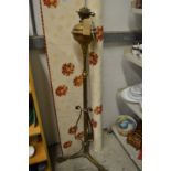 A brass floor standing oil lamp.
