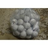 A bag of Taylor Made golf balls.