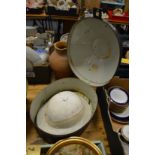 A Pith helmet in black Japanned tin hat box.