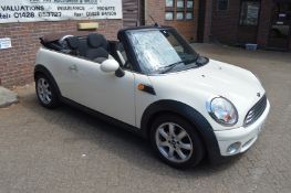 A Mini Cooper two door convertible 1.6 litre petrol engine, 56,000 miles, 12 months MOT, new soft