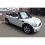 A Mini Cooper two door convertible 1.6 litre petrol engine, 56,000 miles, 12 months MOT, new soft