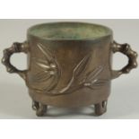 AN 18TH-19TH CENTURY CHINESE BAMBOO DESIGN BRONZE CENSER, with bamboo-form twin handles and raised