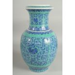 A LARGE CHINESE TURQUOISE GROND BLUE AND WHITE PORCELAIN VASE, with floral motif decoration, base