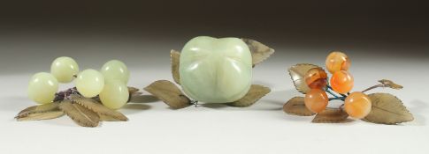 A CARVED JADE BUNCH OF GRAPES, together with another similar hardstone group and a large carved jade