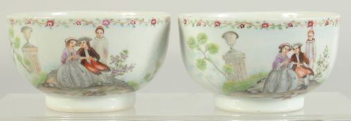 A PAIR OF FAMILLE ROSE PORCELAIN CUPS, with European subjects, cups 8.5cm diameter.