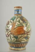 AN IZNIK GLAZED POTTERY BOTTLE VASE, painted with a deer and flora, 21cm high.