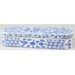 A TURKISH BLUE AND WHITE POTTERY PEN BOX, 28.5cm long.