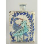 AN IZNIK GLAZED POTTERY BOTTLE, 15cm high.