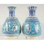 TWO TURKISH BLUE AND WHITE POTTERY VASES, painted with bird motifs and floral decoration, 14cm