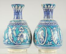 TWO TURKISH BLUE AND WHITE POTTERY VASES, painted with bird motifs and floral decoration, 14cm