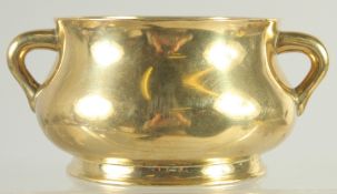 A FINE CHINESE GILT BRONZE TWIN HANDLE CENSER, the base with six-character mark, 13cm wide (handle