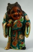 A JAPANESE KUTANI POTTERY FIGURE of Jittoku, 20.5cm high.