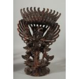 A FINE BALINESE CARVED WOOD FIGURE OF GARUDA, 34.5cm high.