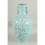 A CHINESE POWDER BLUE GLAZE PORCELAIN CARVED TWIN HANDLE VASE, the vase with carved decoration