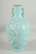 A CHINESE POWDER BLUE GLAZE PORCELAIN CARVED TWIN HANDLE VASE, the vase with carved decoration
