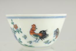 A CHINESE DOUCAI PORCELAIN TEA CUP, 8cm diameter.