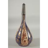 A 19TH CENTURY HISPANO MORESQUE COPPER LUSTRE AND BLUE GLAZE BOTTLE, with embossed silver mounted
