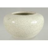 A CHINESE CRACKLE GLAZE BRUSH POT, 10cm diameter.