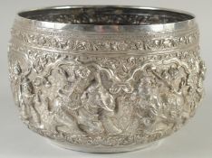 A FINE LARGE 19TH CENTURY BURMESE SILVER BOWL, with repousse decoration, 22cm diameter. weight