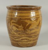 A CHINESE EARTHENWARE GLAZED POTTERY JARDINIERE PLANTER, decorated with dragon, 30cm high.