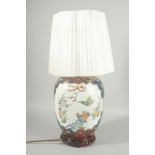 AN IMARI STYLE PORCELAIN LAMP, mounted to a hardwood stand, shade included.