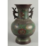 A CHINESE ENAMELLED BRONZE TWIN HANDLE VASE, the enamelled bands with decorative flora, base with