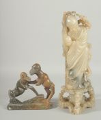 A LARGE CHINESE CARVED SOAPSTONE FIGURE OF SHOU LAO, together with a smaller hardstone carving of