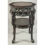 A FINE CHINESE MARBLE INSET CARVED HARDWOOD OCTAGONAL STAND, with carved and pierced foliate