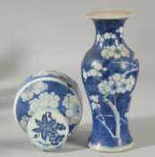 A CHINESE BLUE AND WHITE PORCELAIN PRUNUS VASE, together with two blue and white lids (af), (3).