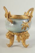A CHINESE POWDER BLUE CRACKLE GLAZE BRASS MOUNTED CENSER, with dragon form handles mounted to the