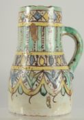 A 19TH CENTURY MOROCCAN POTTERY JUG, 19cm high.