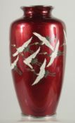 AN ANDO STYLE JAPANESE GINBARI CLOISONNE VASE, with cranes, 24.5cm high.