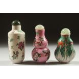 THREE CHINESE SNUFF BOTTLES AND STOPPERS, each with character mark to base, (3).