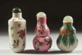 THREE CHINESE SNUFF BOTTLES AND STOPPERS, each with character mark to base, (3).