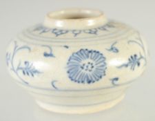 A SMALL CHINESE BLUE AND WHITE GLAZED POTTERY WATER POT, painted with foliate motifs, with applied