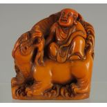 A CHINESE FIGURAL SEAL OF LOHAN, 9.5cm high.