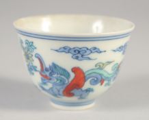 A SMALL CHINESE DOUCAI 'KUI DRAGON' CUP, six-character mark to base, 5.5cm diameter.