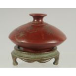 A CHINESE YIXING WATER POT AND BRONZE STAND, the base with character mark, 9cm diameter.