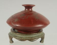 A CHINESE YIXING WATER POT AND BRONZE STAND, the base with character mark, 9cm diameter.