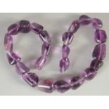 AN AMETHYST BEADED NECKLACE.