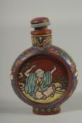 AN UNUSUAL CHINESE YIXING SNUFF BOTTLE AND STOPPER, with enamel painted decoration, 8.5cm high.