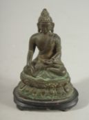A SMALL BRONZE SEATED BUDDHA ON DOUBLE-LOTUS BASE, Shakyamuni in dhyanasana, mounted to a wooden