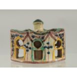 A 19TH CENTURY MOROCCAN LIDDED POTTERY INKWELL, 7.5cm wide.