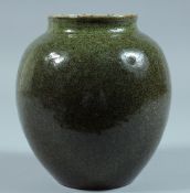 A CHINESE GREEN GLAZED JAR.