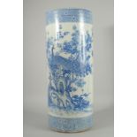 A CHINESE BLUE AND WHITE PORCELAIN WALKING STICK STAND, decorated with a peacock and native flora,